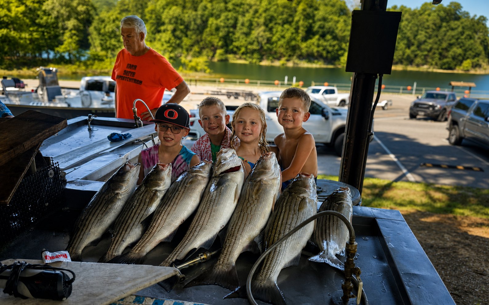 Young angler with a striped bass
